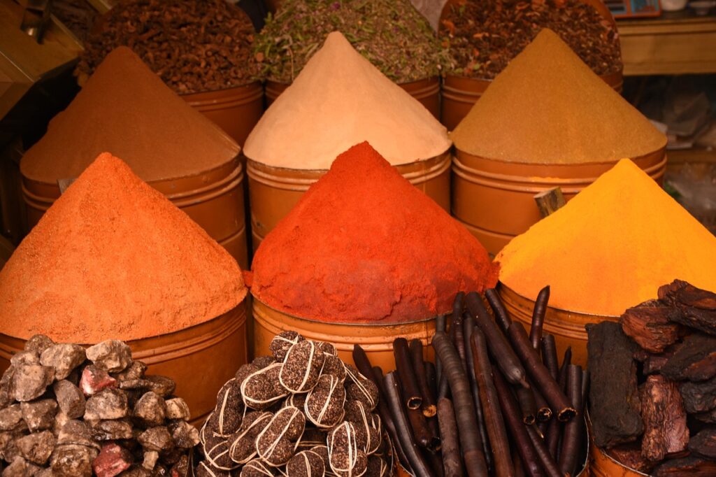 Traditional Moroccan tagine with vegetables and spices served in a clay pot