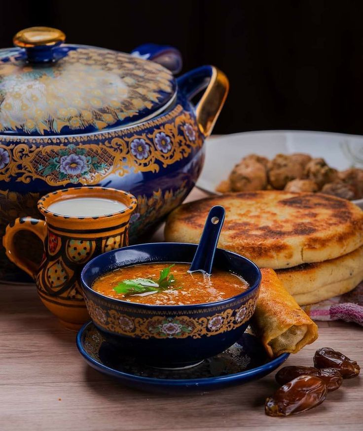 Traditional Moroccan harira soup served with dates and chebakia during Ramadan.
